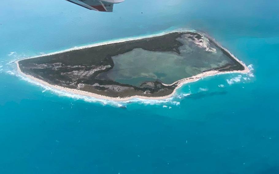 A U.S. Coast Guard C-144 Ocean Sentry circles above Cay Sal Bank in the Bahamas Saturday, Jan. 14, 2023. 