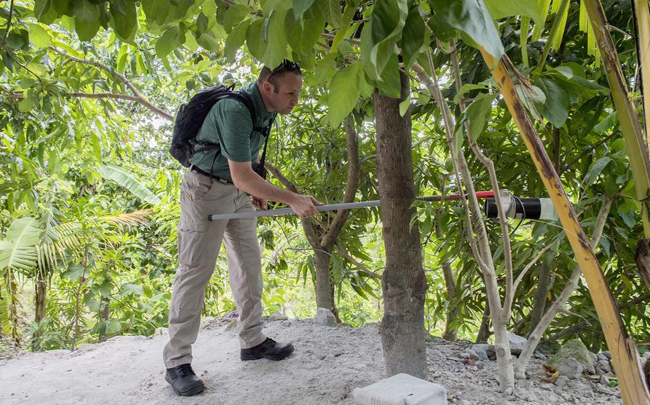Army Capt. Patrick McClellan, an entomologist with Joint Task Force-Bravo, vacuums insects during a Leishmaniasis investigation in La Libertad, Honduras, July 9, 2019.