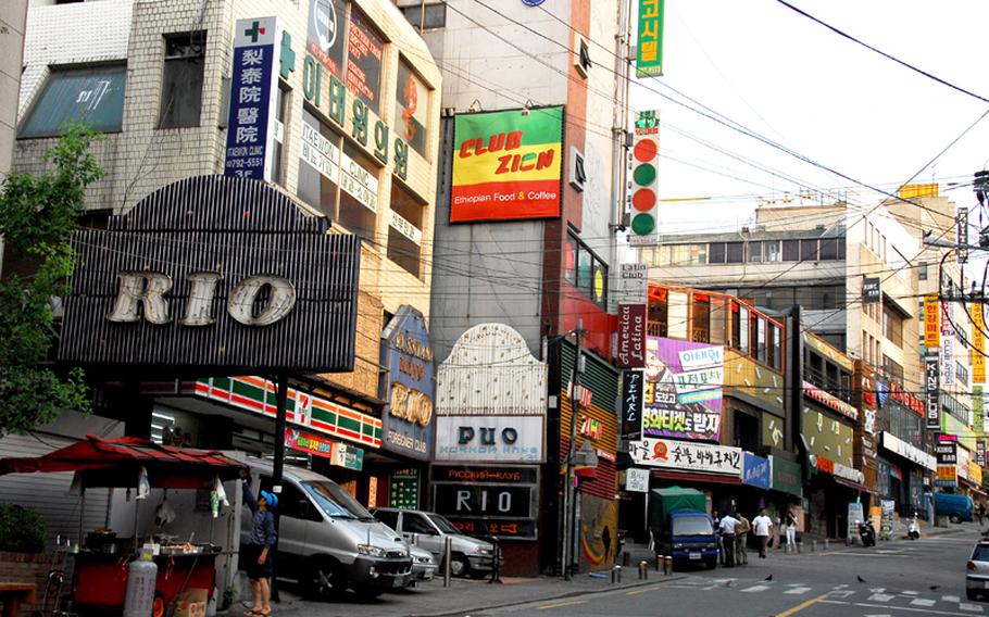 Clubs and restaurants popular with U.S. troops line this street in Itaewon, the neighborhood outside U.S. Army Garrison-Yongsan. U.S. Forces Korea will end a 9-year-old curfew for all troops on the peninsula on July 2, which now requires them to be indoors on weekends for two hours and on weekdays for five hours.