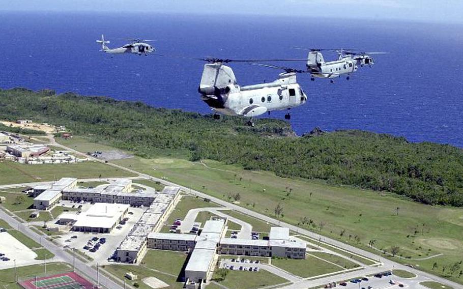 Two UH-46 Sea Knights and two MH-60 Knight Hawks fly over Andersen Air Force Base, Guam, in this file photo.