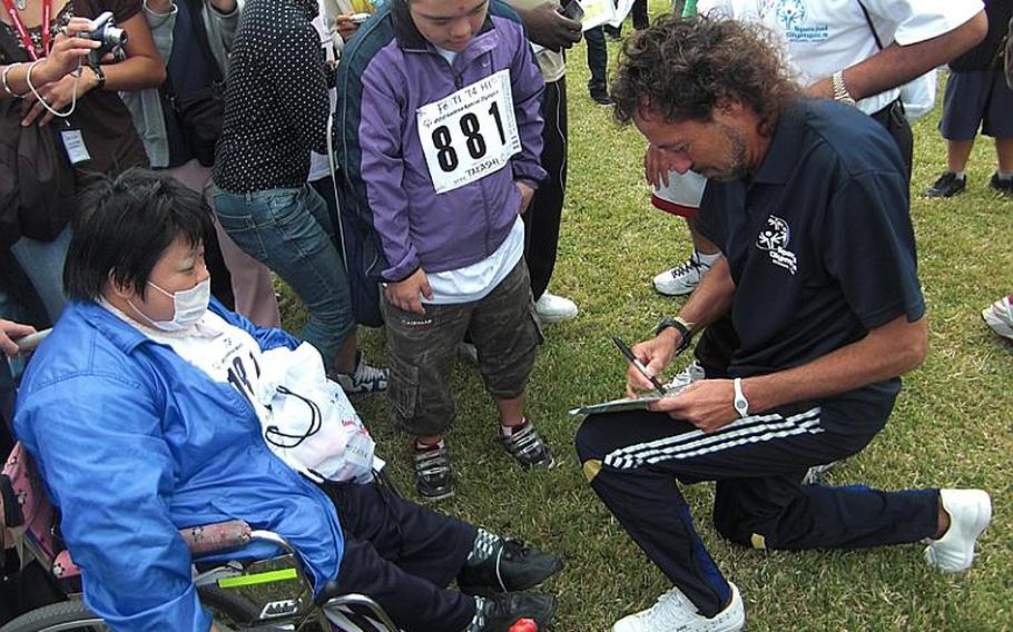 Professional soccer player Ramos Rui attracts crowds of athletes during the Kadena Special Olympics on Saturday at Kadena Air Base.