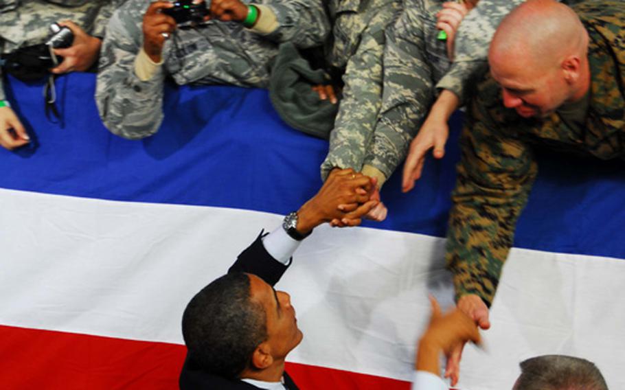 President Barack Obama shakes hands with servicemembers who packed Collier Field House at U.S. Army Garrison-Yongsan, in Seoul, to hear the president deliver a Veterans Day speech on Nov. 11, 2010.