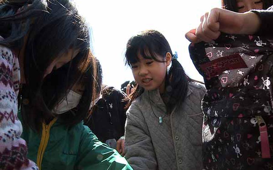 Excited children at Minato Elementary School eagerly receive backpacks full of toys, clothes, blankets, and hygiene items through “Operation Backpack.” Backpacks have been handed out to the displaced children in northern Japan following the devastating March 11 earthquake and tsunami hit the region.
