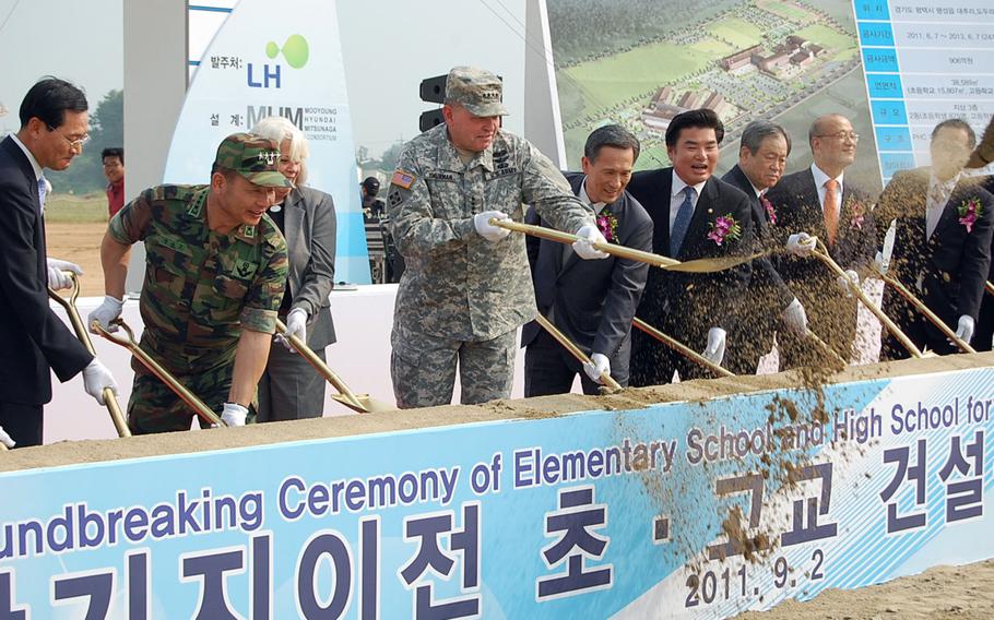 U.S. Forces Korea commander Gen. James Thurman shovels dirt Sept. 2, 2011, at a groundbreaking ceremony in Pyeongtaek for an elementary school and high school that will eventually serve the U.S. Army Garrison-Humphreys community.