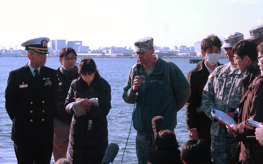 The USS Lassen's skipper, Cmdr. Chip Wrye, left, and Army Lt. Col. Gregory Bunn take questions from the Japanese media prior to a disaster evacuation exercise at the Tokyo Lumber Pier on Feb. 3, 2012. The Lassen and the Army's USS Fort McHenry each helped evacuate dozens of people playing the roles of stranded commuters. About 10,000 people citywide took part in the drill.
