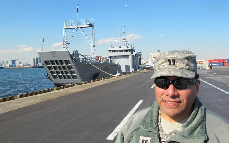 Capt. Marco Ramos, a logistics training officer, explains the role of the Army's USS Fort McHenry during a disaster evacuation exercise at the Tokyo Lumber Pier on Feb. 3, 2012.
