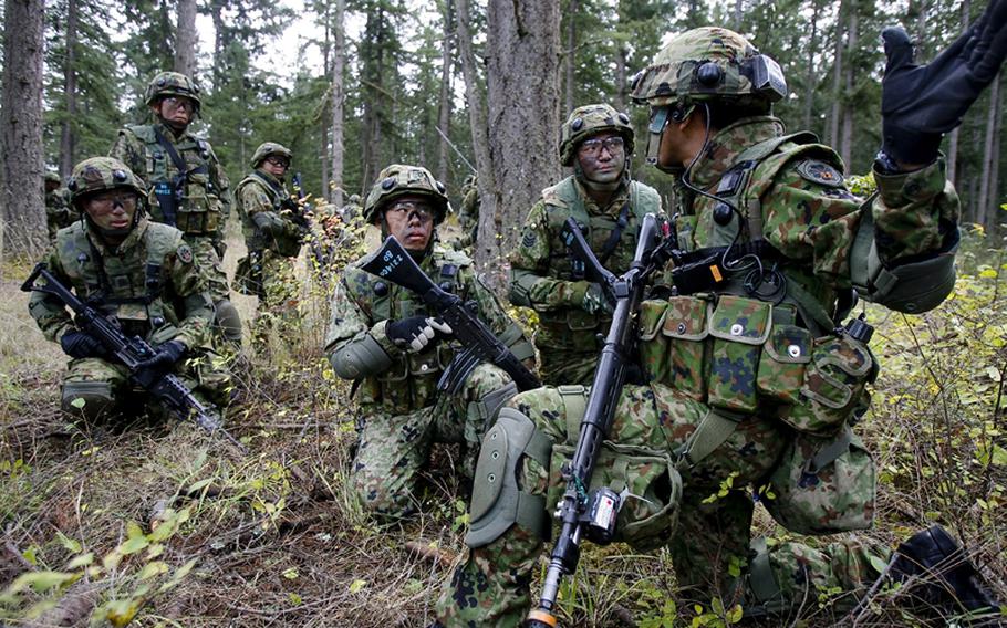 Japanese soldiers from the 22nd Infantry Regiment of the Japan Ground Self-Defense Force train in urban assault with American Soldiers from 1st Battalion, 17th Infantry Regiment, 5th Brigade Oct. 17, 2008 during a bilateral exercise at Fort Lewis' Leschi Town.