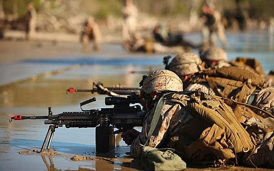 Marines with Company G., Battalion Landing Team 2nd Battalion, 7th Marine Expeditionary Unit, secure  Freshwater Beach during an amphibious assault exercise in Australia in 2011. A Chinese military newspaper April 21, 2012, accused the United States of adversely impacting the South China Sea region.