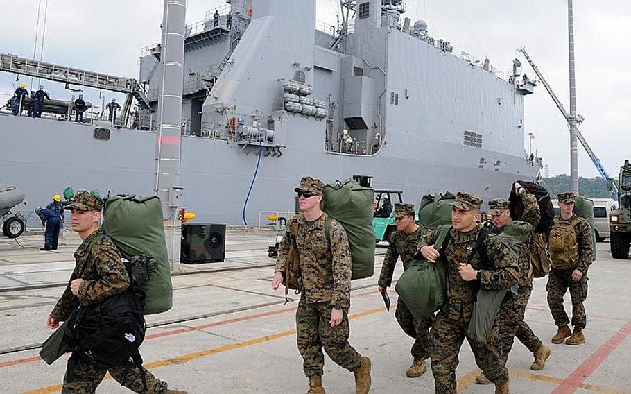 Marines of the 31st Marine Expeditionary Unit prepare to board the USS Germantown, on Feb. 2, 2012, at U.S. Naval Facility Whte Beach, Okinawa. The Marines were taking part in a patrol of the Asia-Pacific region. Due to concerns raised by the Senate, the U.S. and Japan have delayed unveiling a new agreement on the realignment of military forces in the Pacific.