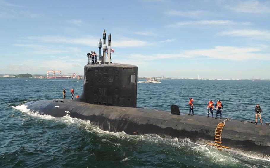 In this file photo from 2010, the Virginia-class attack submarine USS Hawaii transits Tokyo Bay on the way to Fleet Activities Yokosuka, marking the very first time in the history of the U.S. 7th Fleet that a Virginia-class submarine visited the region.

 
