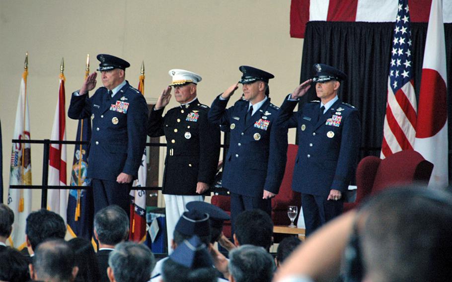 From left: Pacific Air Forces commander Gen. Gary L. North, Pacific Command deputy commander Lt. Gen. Thomas L. Conant, outgoing U.S. Forces Japan and 5th Air Force commander Lt. Gen. Burton Field and new U.S. Forces Japan and 5th Air Force commander Lt. Gen. Salvatore A. Angelella salute during a change-of-command ceremony July 20, 2012, at Yokota Air Base, Japan. 