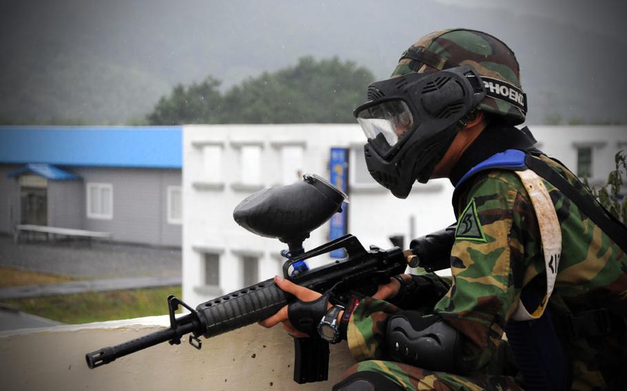 A South Korean soldier provides over-watch during training with members of 498th Combat Sustainment Support Battalion, 501st Sustainment Brigade near Busan, South Korea, Aug. 19, 2011. The units trained together during Ulchi Freedom Guardian 2011.