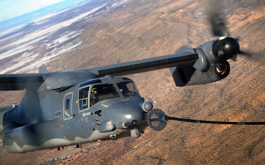 A 71st Special Operations Squadron CV-22 Osprey receives fuel from a 522 SOS, MC-130J Combat Shadow II aircraft, over the skies of New Mexico, Jan. 4, 2012.