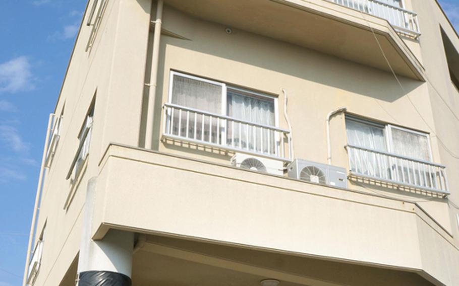 A 24-year-old U.S. airman is accused of punching a young boy in this apartment in Chatan, Okinawa, then falling out a window while trying to escape.