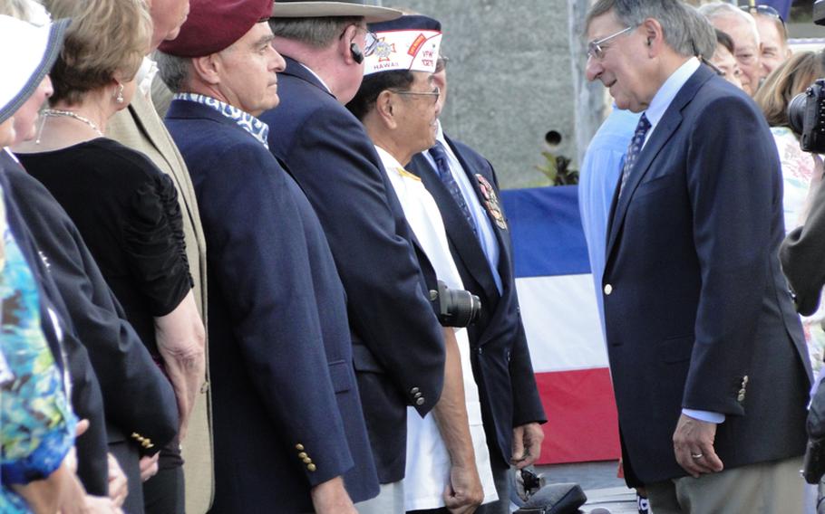 Defense Secretary Leon Panetta speaks with veterans Nov. 11, 2011, at the National Memorial Cemetery of the Pacific in Honolulu, Hawaii, before embarking on a trip to Asian nations. 