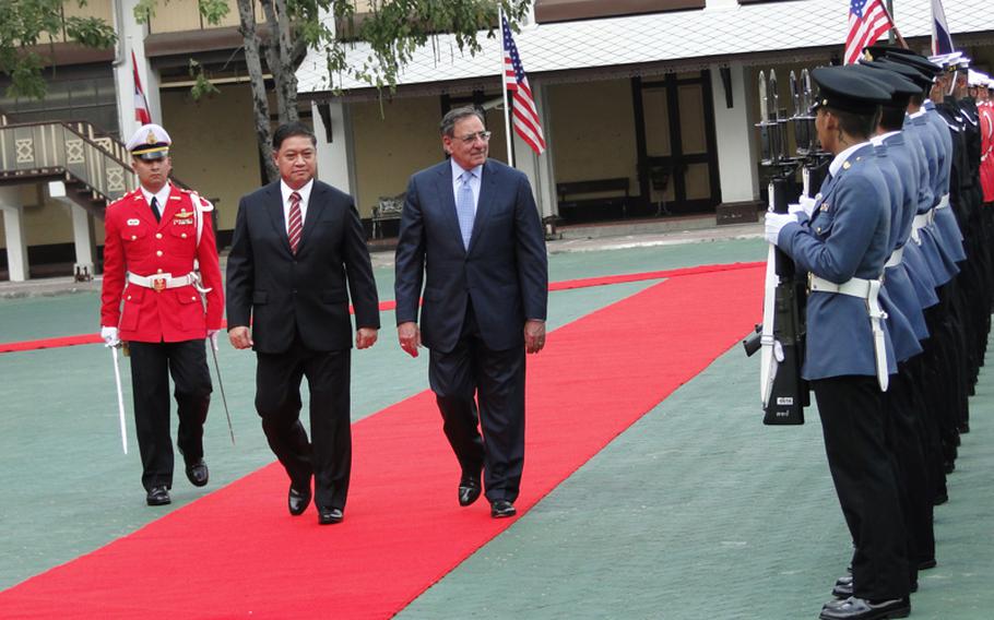 Thai Minister of Defense Sukampol Suwannathat and U.S. Secretary of Defense Leon Panetta review the troops before a meeting at the Thai defense ministry on Nov. 15, 2012.