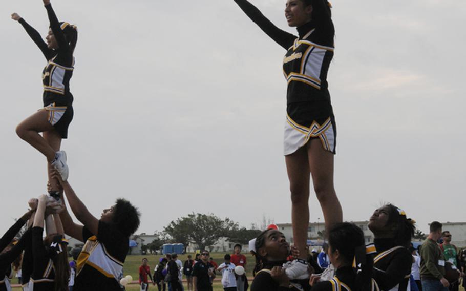 Kadena Panthers cheerleading squad perform at the opening ceremony of the Kadena Special Olympic Saturday. 
The annual sports event for special -needs athletes has been supported by goodwill volunteers.
On Saturday, nearly 3,000 servicemembers, civilians and their families in U.S. military communities on the island, as well as Japanese volunteers, join the event to support about 900 athletes to compete in various games, such as 30-meters dash, wheelchair softball throw, floor hockey, frisbee toss and basketball throw. 