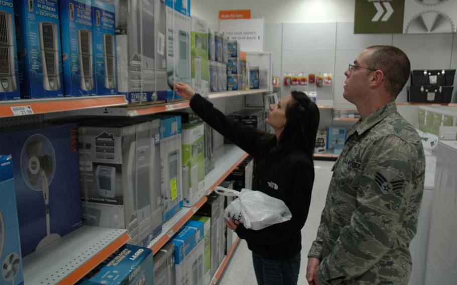 Heather Bollinger and her husband, Senior Airman Patrick Bollinger, of Pittsburgh, check out heaters, fans and dehumidifiers on sale at a store on Yokota Air Base, Japan, on March 15, 2013. 
