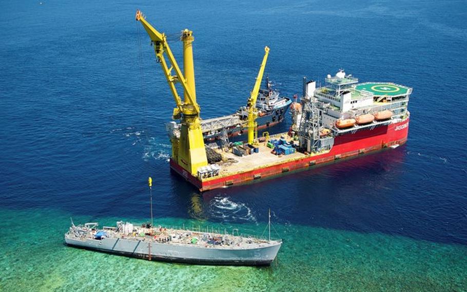 Aerial shot shows contracted vessels working on the dismantling of the USS Guardian off the Tubbataha Reef in the Sulu Sea, off the coast of the Philippines, March 12, 2013. 