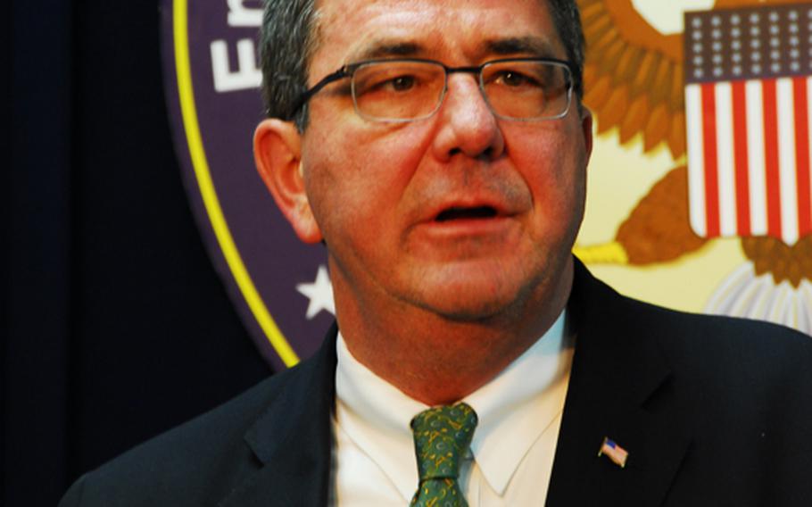 U.S. Deputy Secretary of Defense Ashton Carter speaks to reporters March 18, 2013, at the U.S. Embassy Annex in Seoul, where he met with South Korean government officials earlier in the day. He said deep cuts in the U.S. defense budget will not affect military operations in South Korea.