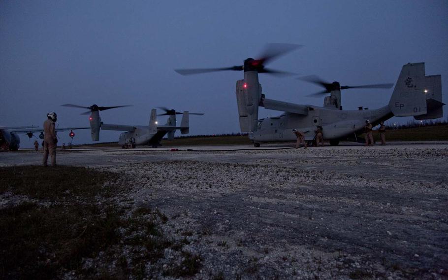Marines refuel two MV-22B Ospreys during a ground refueling exercise on Ie Shima Airfield in Okinawa on April 15, 2013.