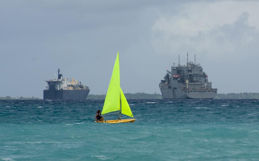 A sailor assigned to U.S. Naval Support Facility Diego Garcia relaxes on a Sunday afternoon by sailing on a Pico sailboat near the Morale, Welfare and Recreation Marina in this Nov. 2012 photo.