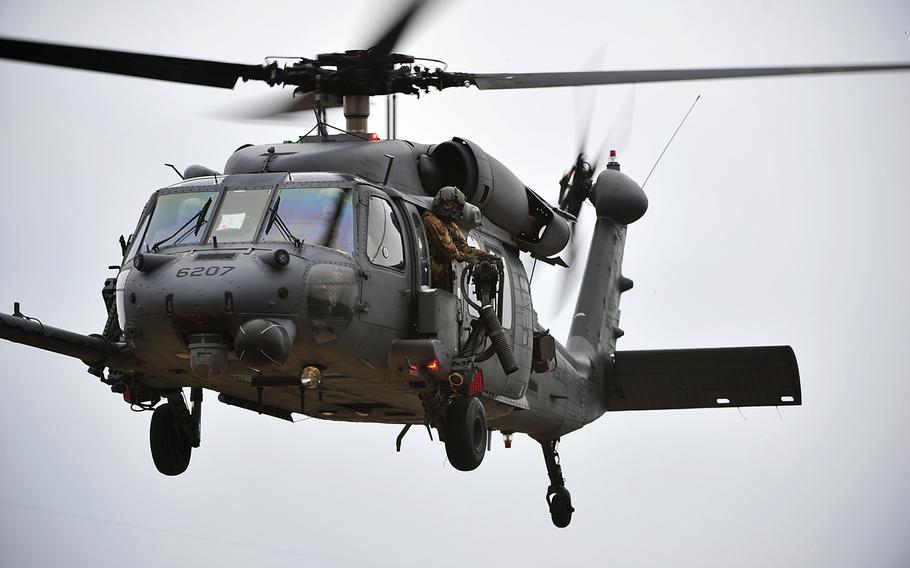 An Air Force HH-60 Pave Hawk helicopter from the 33rd Rescue Squadron takes part in an exercise at the Marine Corps' Camp Hansen's Combat Town, Japan, in this February 2013 file photo. The Air Force said that an HH-60 crashed on Okinawa on Aug. 5, 2013.  