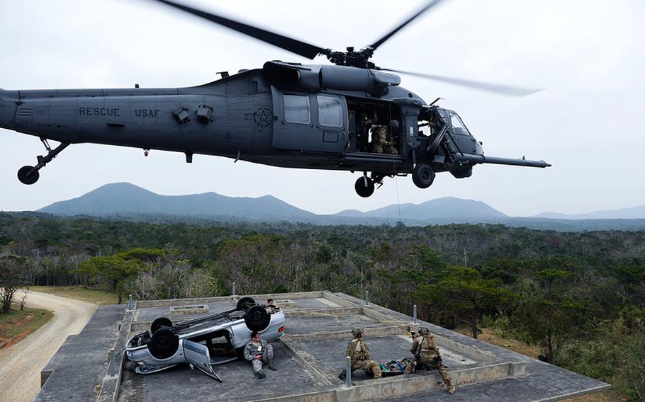 The U.S. Air Force 31st and 33rd Rescue Squadrons use a HH-60 Pave Hawk helicopter to evacuate ‘victims’ during a simulated crash at Camp Hansen, a training area used by the Okinawa squads assigned to Kadena Air Base, Feb. 7, 2013. 