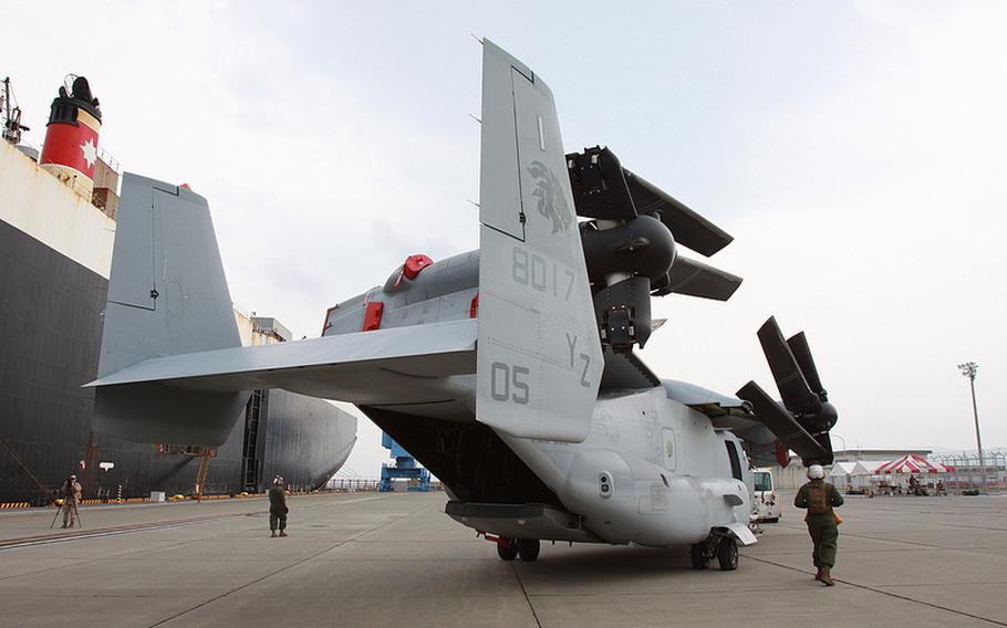 A second squadron of MV-22 Osprey aircraft are unloaded at Marine Corps Air Station Iwakuni, in Yamaguchi, Japan, July 30, 2013.