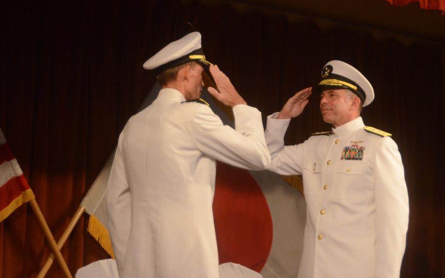 Rear Adm. Terry Kraft, right, relieves Rear Adm. Dan Cloyd and assumes command of Naval Forces Japan at Yokosuka Naval Base on Friday. Kraft arrives from the Navy Warfare Development Command in Norfolk, Va.

