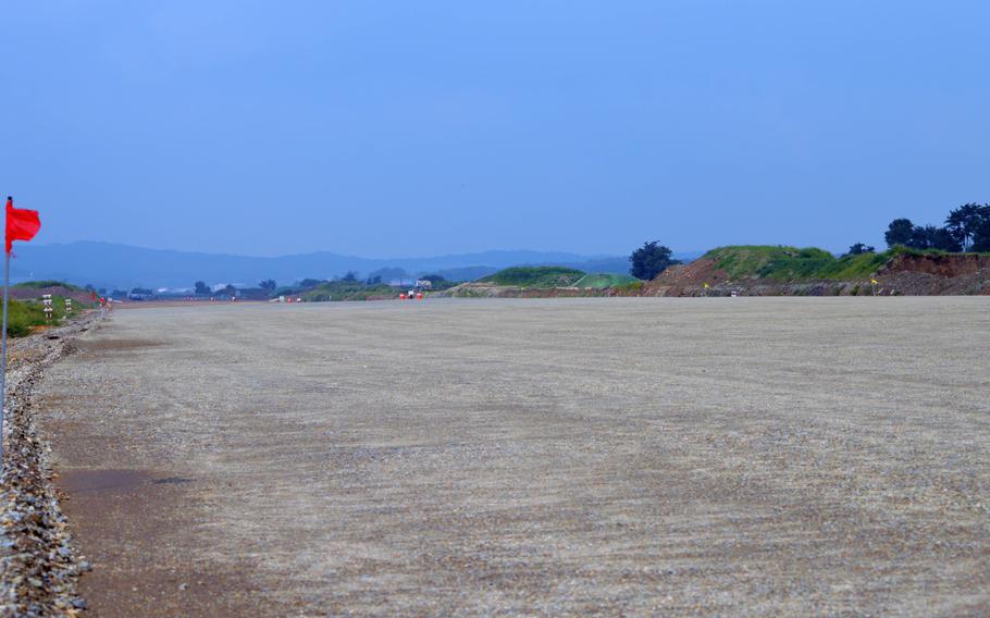 A portion of smoothed and graded area for the new runway for Osan Air Base, South Korea, Aug. 30, 2013. The construction will allow for a second parallel runway.
