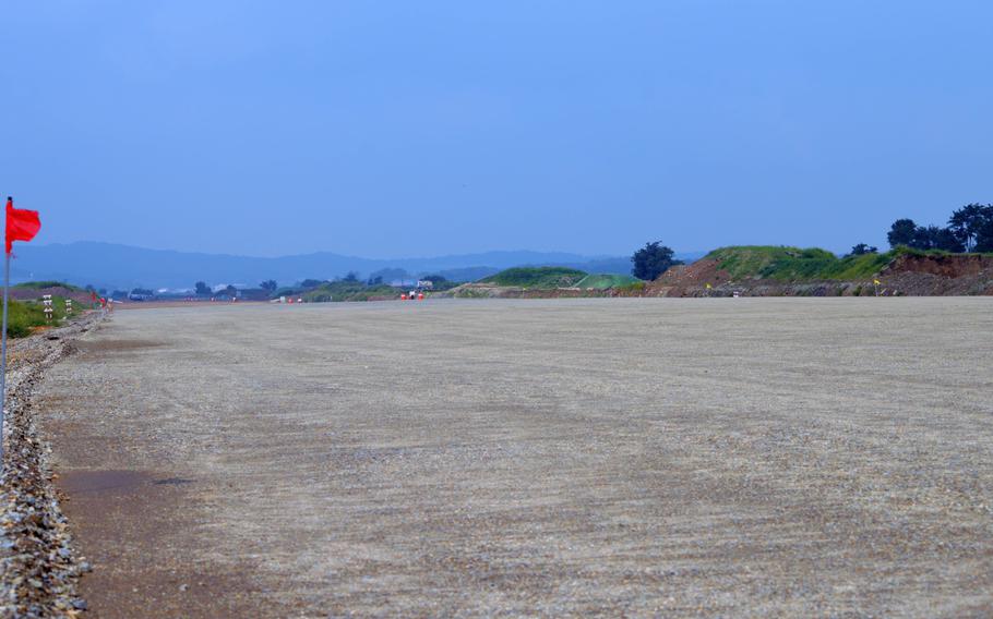 A portion of smoothed and graded area for the new runway for Osan Air Base, South Korea, Aug. 30, 2013. The construction will allow for a second parallel runway. 