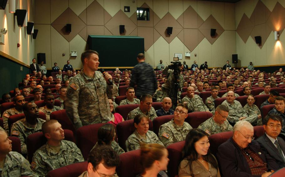 A soldier asks a question during a town hall-style meeting on Tuesday, Oct. 1, 2013, at Yongsan Garrison in South Korea led by Gen. Martin Dempsey, chairman of the Joint Chiefs of Staff, and his wife Deanie.


