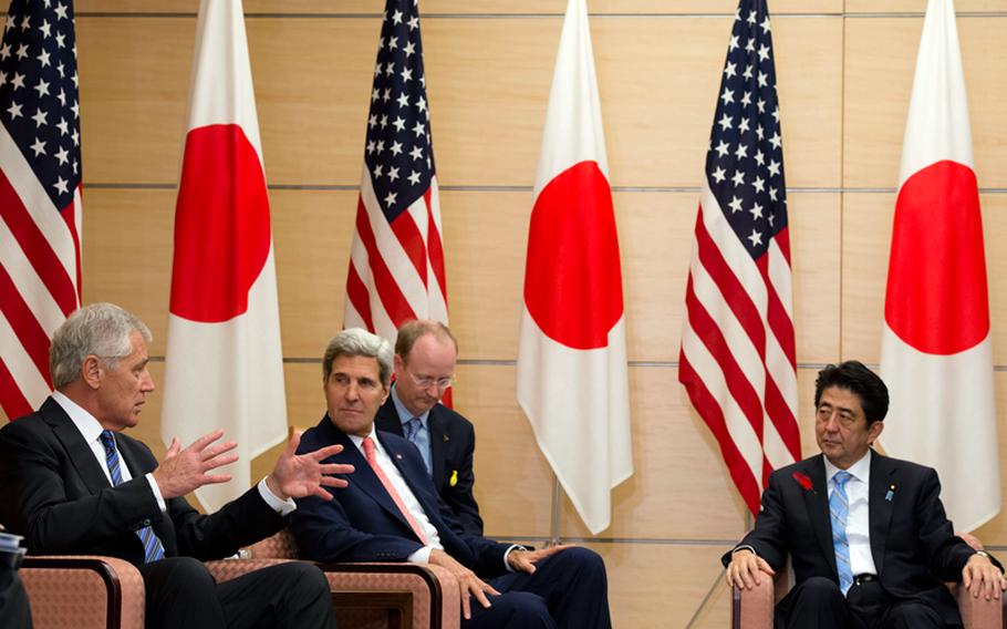 U.S. Defense Secretary Chuck Hagel (from left), U.S. Secretary of State John F. Kerry and Japanese Prime Minister Shinzo Abe meet at the prime minister’s residence in Tokyo, Oct. 3, 2013.
