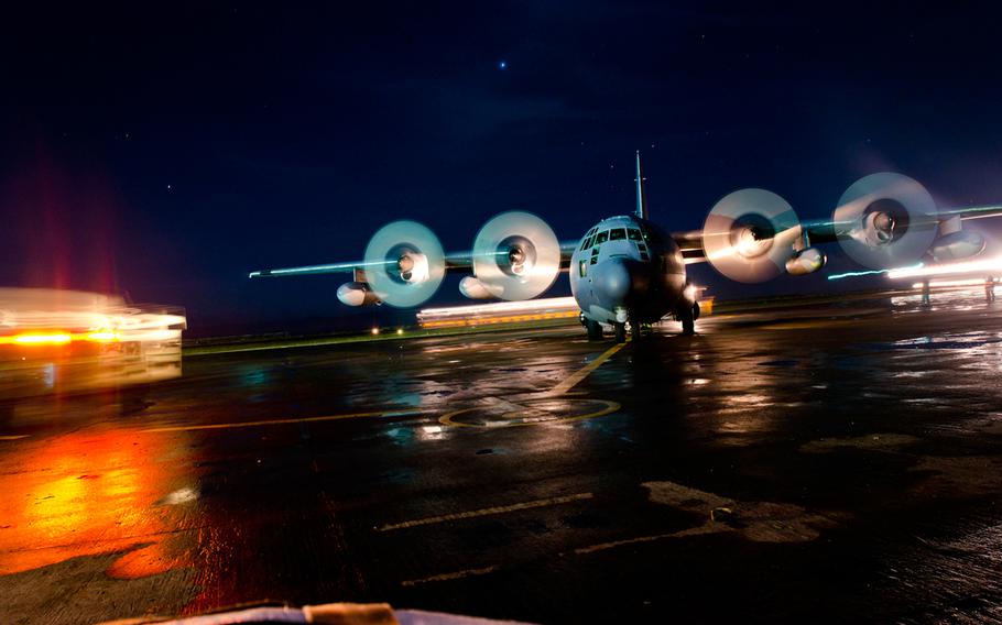 An aircraft at Tacloban Airport, Philippines, waits on the runway as victims of Super Typhoon Haiyan prepare to board.