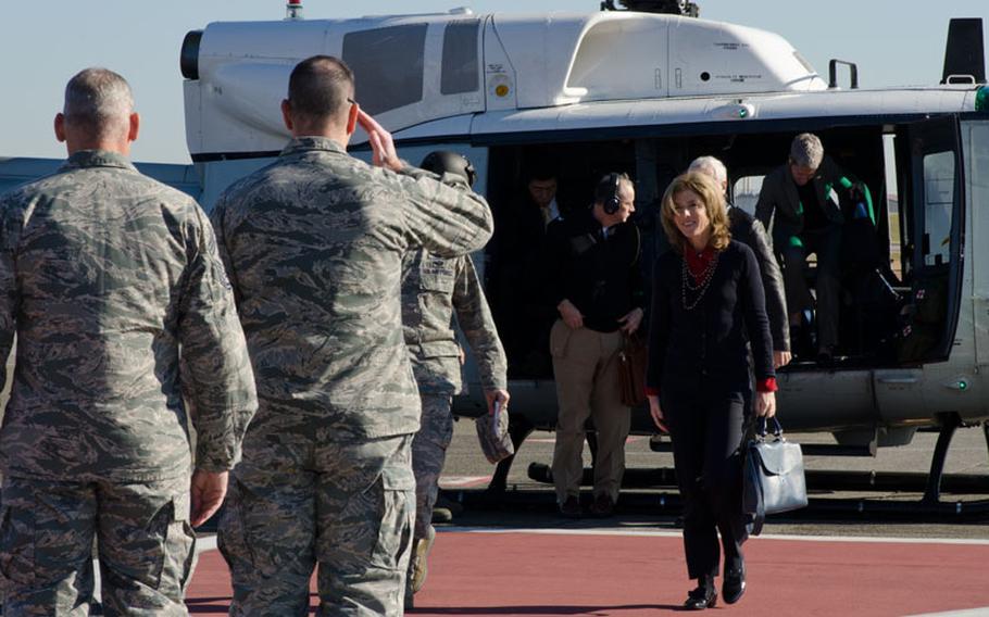 U.S. Ambassador to Japan Caroline Kennedy is greeted by U.S. servicemembers as she arrives for a day of meetings with airmen and senior Japanese officials at Yokota Air Base, Japan, on Thursday, Nov. 21, 2013.
