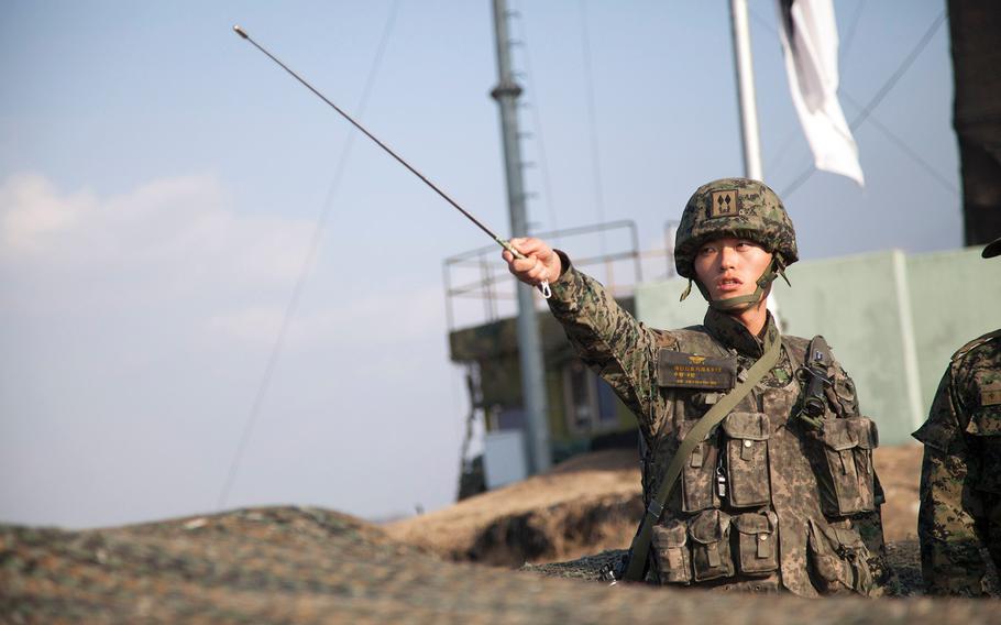 A South Korean military officer points across the boarder into North Korea while briefing U.S. Vice President Joe Biden at Observation Point Ouellette on Dec. 7, 2013.  