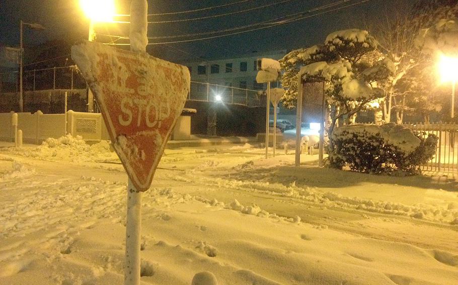 Snow covers the streets Saturday night at Yokosuka Naval Base, Japan. The storm was expected to bring more than one foot of snow to other U.S. military bases in the western part of the Tokyo region, along with gale force winds.
