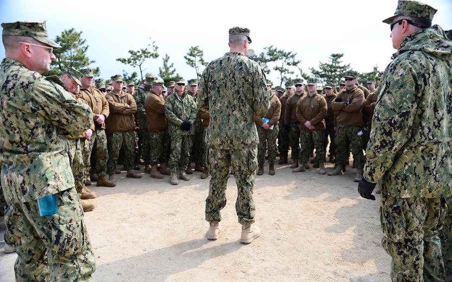 A Coast Guard port security unit listens to their commander before a land and sea exercise, all part of Foal Eagle 2013 in Pohang, South Korea, April 15, 2013.