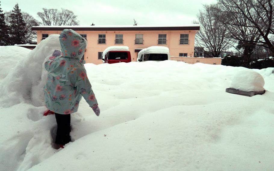 Residents at Yokota Air Base in Japan woke up Saturday, Feb. 14, 2014, to as much as 2 feet of snow on the ground. The official measurements may break the record snowfall recorded just a week earlier.