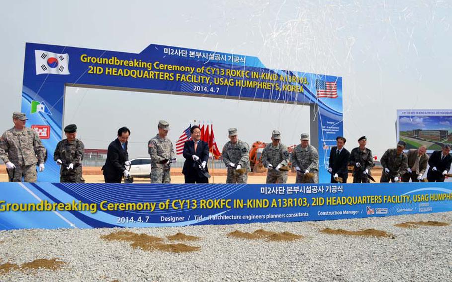 Members of 2nd Infantry Division, U.S. Forces Korea and South Korean military perform the ceremonial shoveling for the new 2ID headquarters Freeman Hall at Camp Humphreys, South Korea on April 7, 2014. The completion date is set for February 2016.  