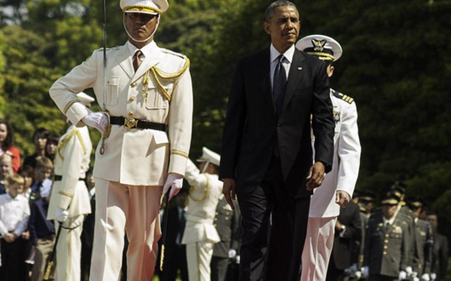 President Barack Obama reviews troops from the Japanese Self-Defense Force during a welcome ceremony as he arrived at the Imperial Palace in Tokyo, Thursday, April 24, 2014. 