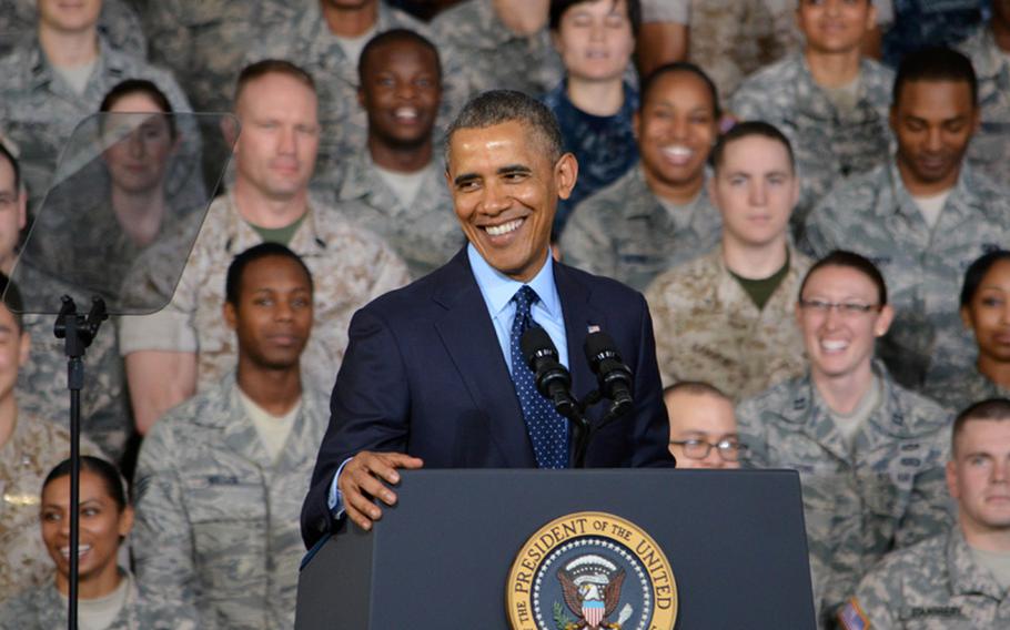 Troops and their families laugh after President Barack Obama tells a joke during a speech at Yongsan Garrison, South Korea, on Saturday, April 26, 2014. The speech capped his 2-day tour of the country prior to departing for Malaysia.