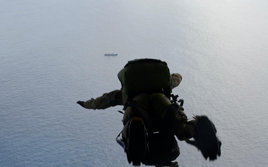 A U.S. Air Force pararescue airman from the 48th Rescue Squadron parachutes into the Pacific Ocean to aid to two critically injured sailors aboard a Venezuelan fishing boat May 3, 2014. 