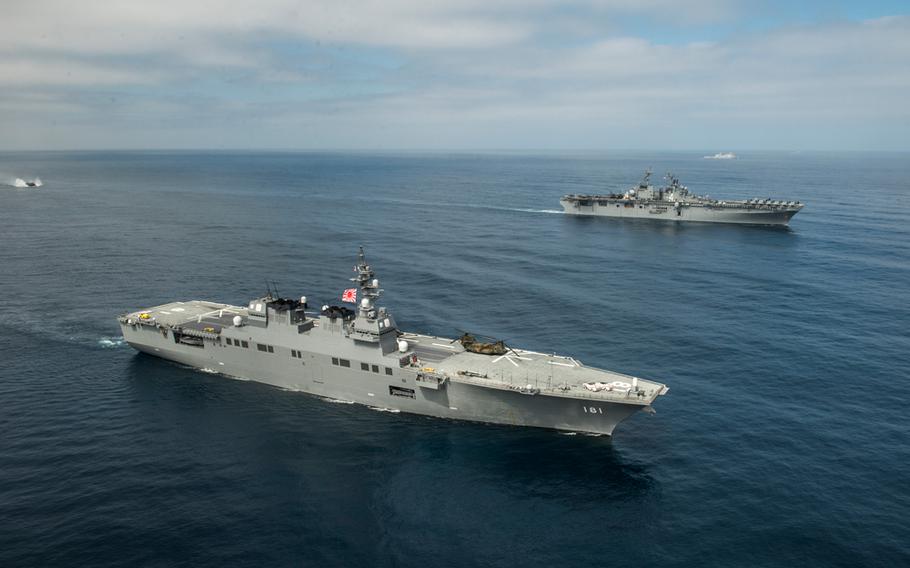 The Japanese Maritime Self-Defense Force (JMSDF) ship Hyuga, front, and the amphibious assault ship USS Boxer during the Dawn Blitz exercise in San Diego, Calif., June 12, 2013.