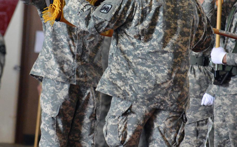 Lt. Col. Brian Watkins, 4th Squadron, 6th Cavalry Regiment commander, cases his squadron's colors during a transfer of authority ceremony at Camp Humphreys, South Korea, on June 25, 2014. The 4th Squadron, 6th Cavalry Regiment transferred its authority to the 6-17th to complete its nine-month rotation on the Korean peninsula. 