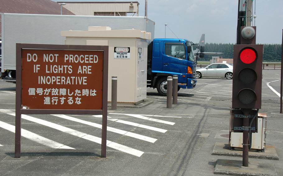 If aircraft are taking off or landing at Yokota Air Base, Japan, motorists have to wait at a stop light if they want to drive from one side of the base to the other, because the flightline splits the base. Drivers on roads crossing the flightline are warned to watch out for jet exhaust and yield to low-flying aircraft.