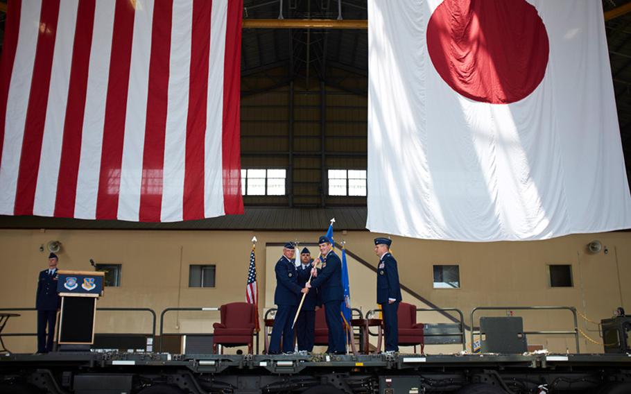Col. Douglas C. Delamater took the reins of the 374th Airlift Wing from outgoing commander Col. Mark "Buzz" August on June 26, 2014, at Yokota Air Base, Japan. Delamater -- who has more than 2,700 flying hours and over 300 combat hours -- arrived at Yokota from Qatar, where he served as the 386th Expeditionary Operations Group commander.