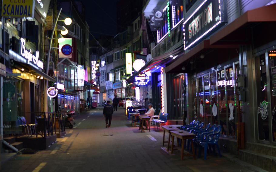 Numerous bars are tightly packed together in "Aragon Alley" in the Sinjang-dong Shopping Mall outside Osan Air Base, South Korea on April 6, 2014. Aragon Alley has the highest concentration of bars in the area. 