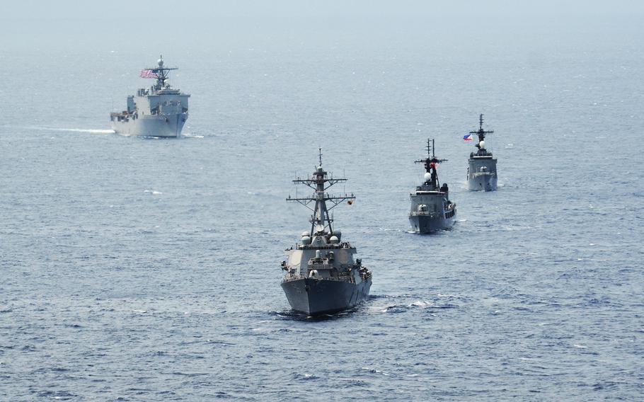 The destroyer USS John S. McCain, bottom, Philippine navy frigates BRP Gregaorio del Pilar and BRP Ramon Alcaraz and the USS Ashland are seen in formation during Cooperation Afloat Readiness and Training (CARAT) Philippines 2014 in the South China Sea on June 28, 2014.